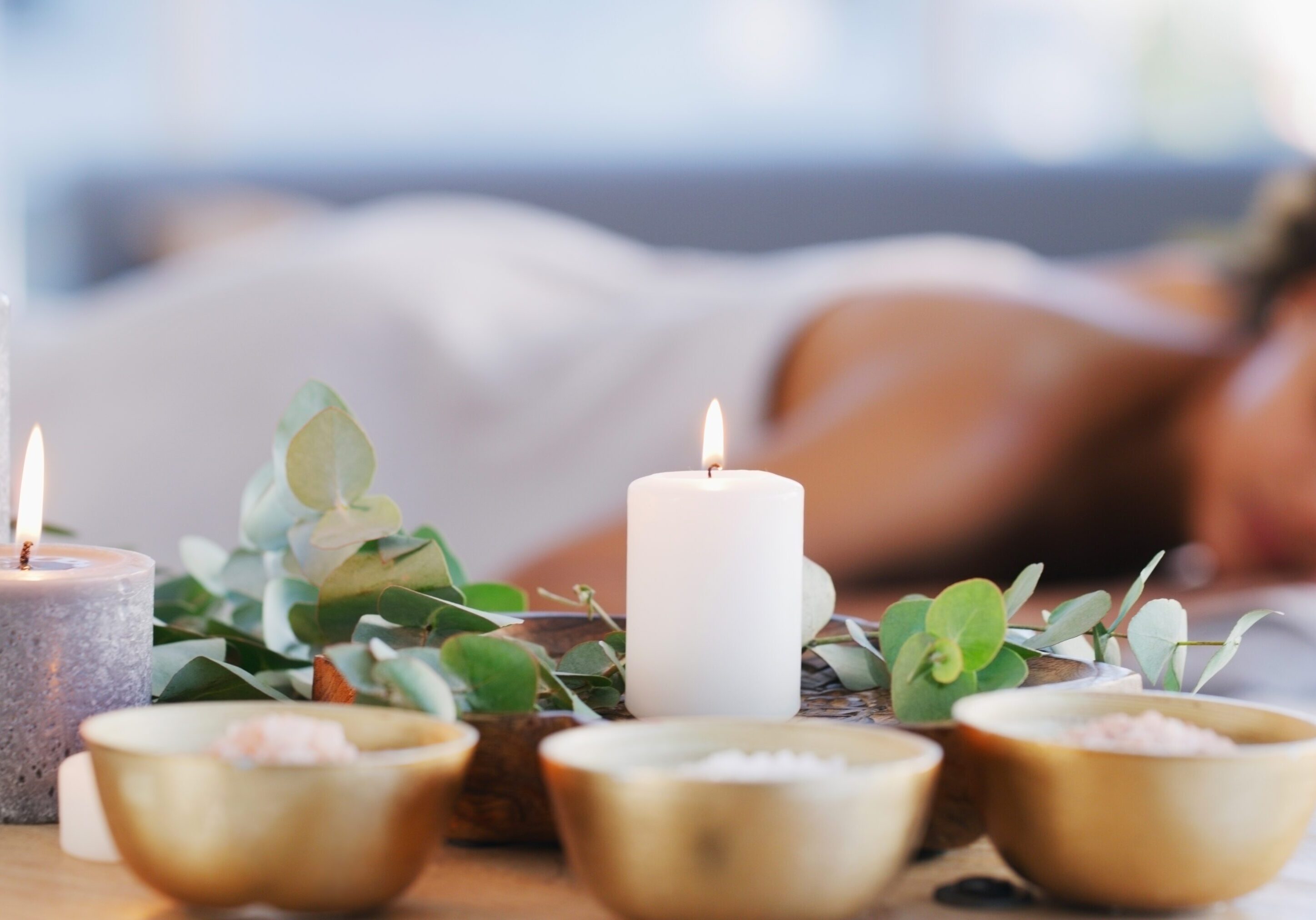 Relax, spa and zen woman with candles for beauty, physical therapy or skincare. Female client on table with candle in ambient room for cosmetics or luxury treatment for skin, health and wellness